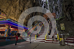 Tourists seen exploring and praying in the Hindu Temple, Batu Caves, Malaysia.