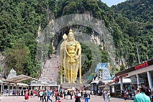 Golden statue of Lord Muragan at the entrance of Batu Caves Hindu Temple near Kuala Lumpur, Malaysia