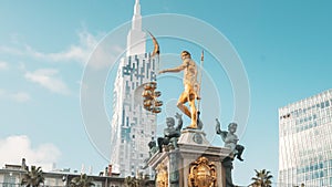 Batumi, Adjara, Georgia. Neptune Fountain in park and Building Of Black Sea Technological University Of Batumi