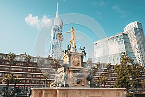 Batumi, Adjara, Georgia. Neptune Fountain in park and Building Of Black Sea Technological University Of Batumi