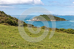 Batuta island with rocks and vegetation photo