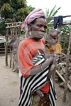 Batwa Pygmy woman and grandchildren in Burundi