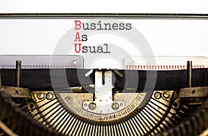 BAU business as usual symbol. Concept words BAU business as usual typed on the old retro typewriter on a beautiful white