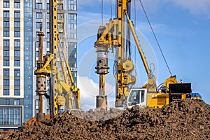 BAUER BG 36 rotary drilling rigs at the Plaza Botanica skyscraper construction site. Construction of bored piles for the