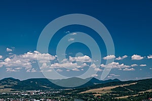 A bautiful sky with small clouds and with village Strecno in Slovakia