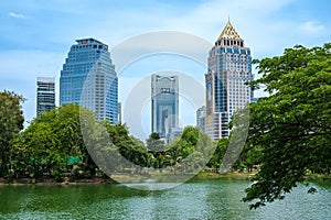 Bautiful view of lake and modern buildings in Lumpini Park, Bangkok, Thailand