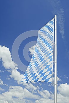 Bavarian flag with white clouds in Germany.