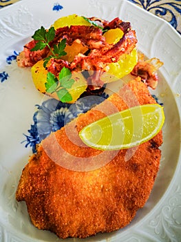 Escalope with fried potatoes photo