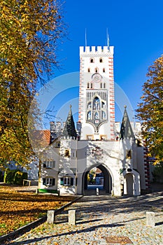 Bavarian gate and trees in autumn colors, Landsberg am Lech, Germany