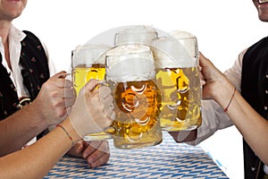 Bavarian group toast with Oktoberfest beer stein