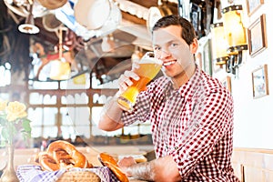 Bavarian man drinking wheat beer