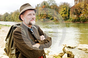 Bavarian man in his 50s standing by the river