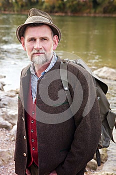 Bavarian man in his 50s standing by the river
