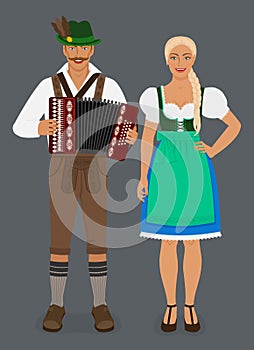 Bavarian man in lederhosen with accordion and girl in Dirndl