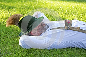 Bavarian man sleeping on the grass