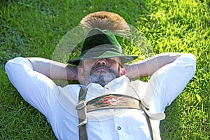 Bavarian man sleeping on the grass