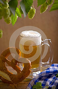 Bavarian Oktoberfest beer and pretzels on wooden table