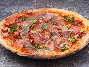 Bavarian pizza with ham, salami, smoked sausages