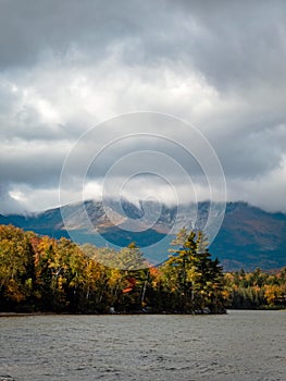 Baxter Peak view surrounded by moody clouds from Lake Katahdin, Maine, in early fall