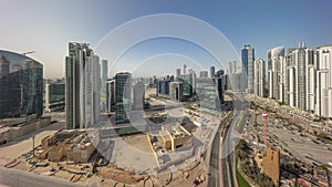 Bay Avenue with modern towers residential development in Business Bay aerial panoramic timelapse during sunrise, Dubai