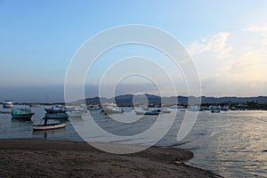 Bay and boats on the water. Low mountains in the distance. Resort on the Red sea coast, Safaga, Egypt