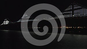 Bay Bridge lights at night in San Francisco, California