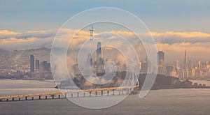 Bay Bridge and San Francisco with Karl the fog enveloping the city at sunset