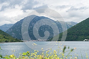 Bay of Kotor. View from the road. Mountains and bay in Montenegro. Scenic Landscape with a big lake and mountain with clouds and