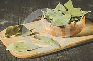 bay leaf in rural style on a wooden plate/spices of bay leaf in rural style. Selective focus