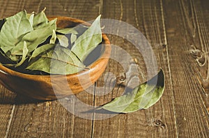 bay leaf in a wooden bowl/bay leaf on a wooden surface. selective focus