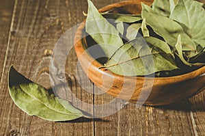 Bay leaf on a wooden surface/bay leaf on a wooden surface. Close up