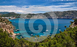 Bay with luxury yachts rocky mountains of Cala Blanca Andratx, Mallorca, Spain