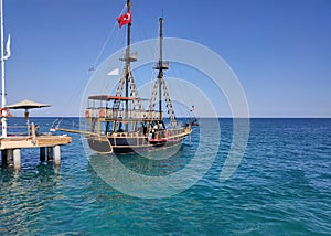 Bay in mediterranean sea with old yacht and fun sun in the Kekova. Turkey.