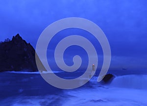 Bay of Pasaia. Waves on the beacons at the mouth of Pasaia with the La Plata lighthouse in the background, Euskadi