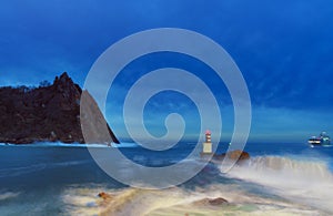 Bay of Pasaia. Waves on the beacons at the mouth of Pasaia with the La Plata lighthouse in the background, Euskadi