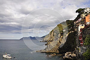 Bay with Rugged Coastline and Residential architecture in Riomaggiore Town from Cinque Terre National Park in Italy