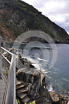 Bay with Rugged Coastline of Riomaggiore Town from Cinque Terre National Park in Italy