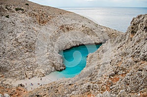 Bay with Seitan Limania beach among rocks with azure water, Crete, Greece.