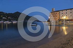 The bay of silence in Sestri Levante illuminated at twilight photo