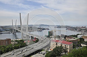 Bay view in Vladivostok, Russia. Warships and fishing ships, boats in marina, port