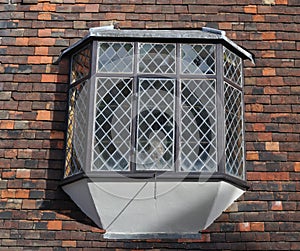 Bay window with leaded glass at historic building