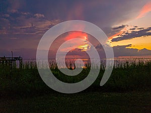 Bayfront Park pier on Mobile Bay at sunset