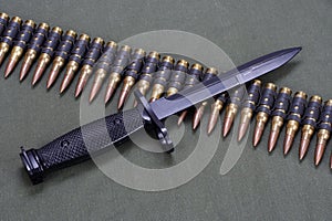 bayonet and ammunition belt on US ARMY uniform background