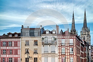 Bayonne in the pays Basque, typical facades, with the cathedral in background