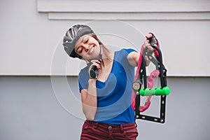 Bicycle lock. Bicycle lock in the hands of the girl. Cycling park