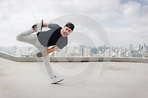 Bboy doing some stunts. Street artist breakdancing outdoors