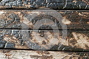 BBQ background. Burnt wooden Board texture. Burned scratched hardwood surface. Smoking wood plank background. Burned wooden grunge