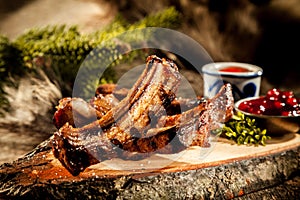 BBQ Boar Spare Ribs Served on Rustic Wood Plank