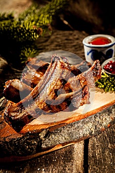 BBQ Boar Spare Ribs Served on Rustic Wood Plank