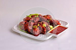 BBQ Chicken Hot & Spicy Wings with green chillis & lecttus photo